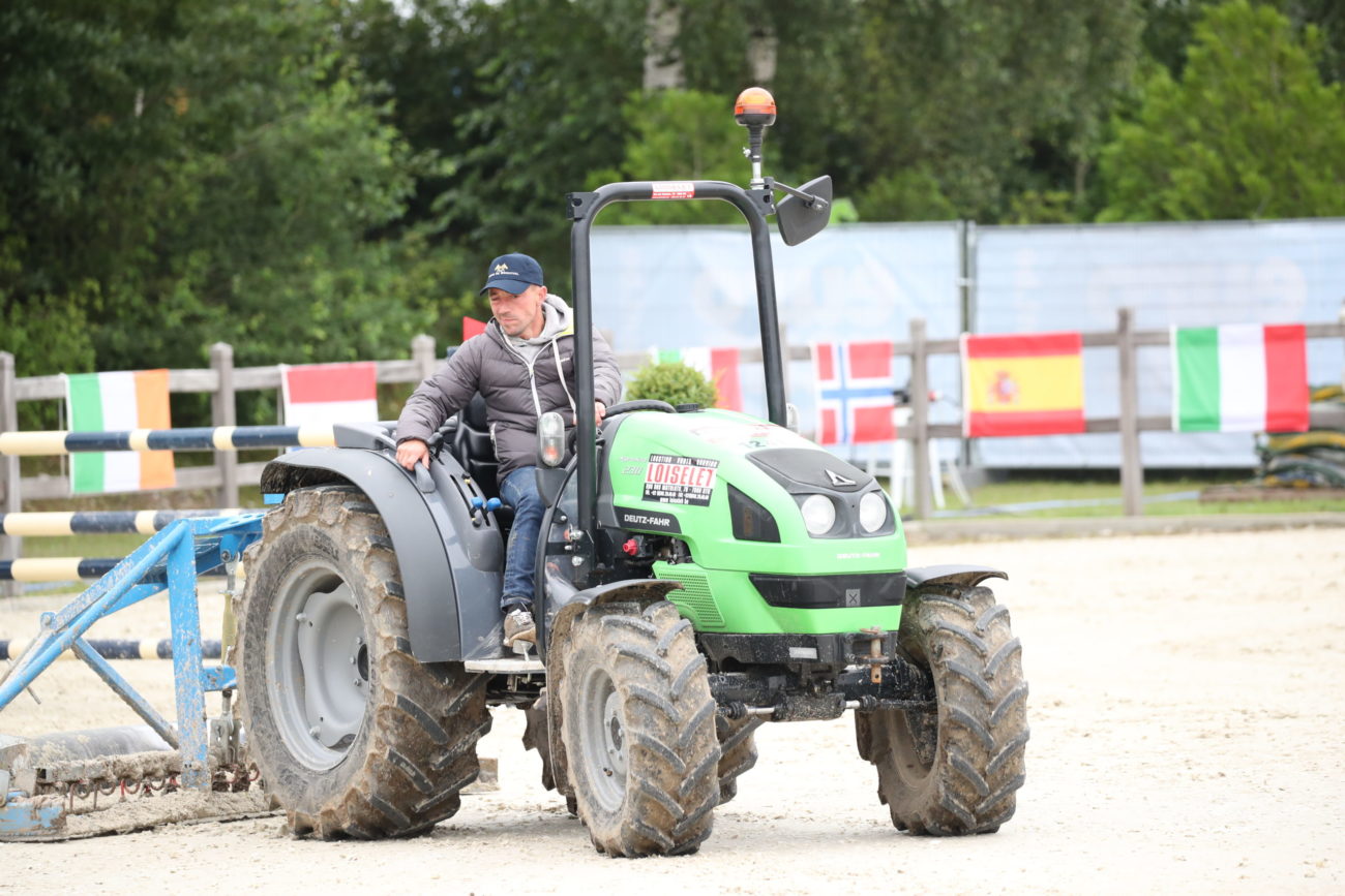 Arena maintenance with tractor